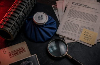 Foam roller and ice pack with magnifying glass and research papers under moody lighting representing recovery myth investigation
