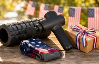July 4th recovery gifts flat lay with massage gun foam roller and gift box
